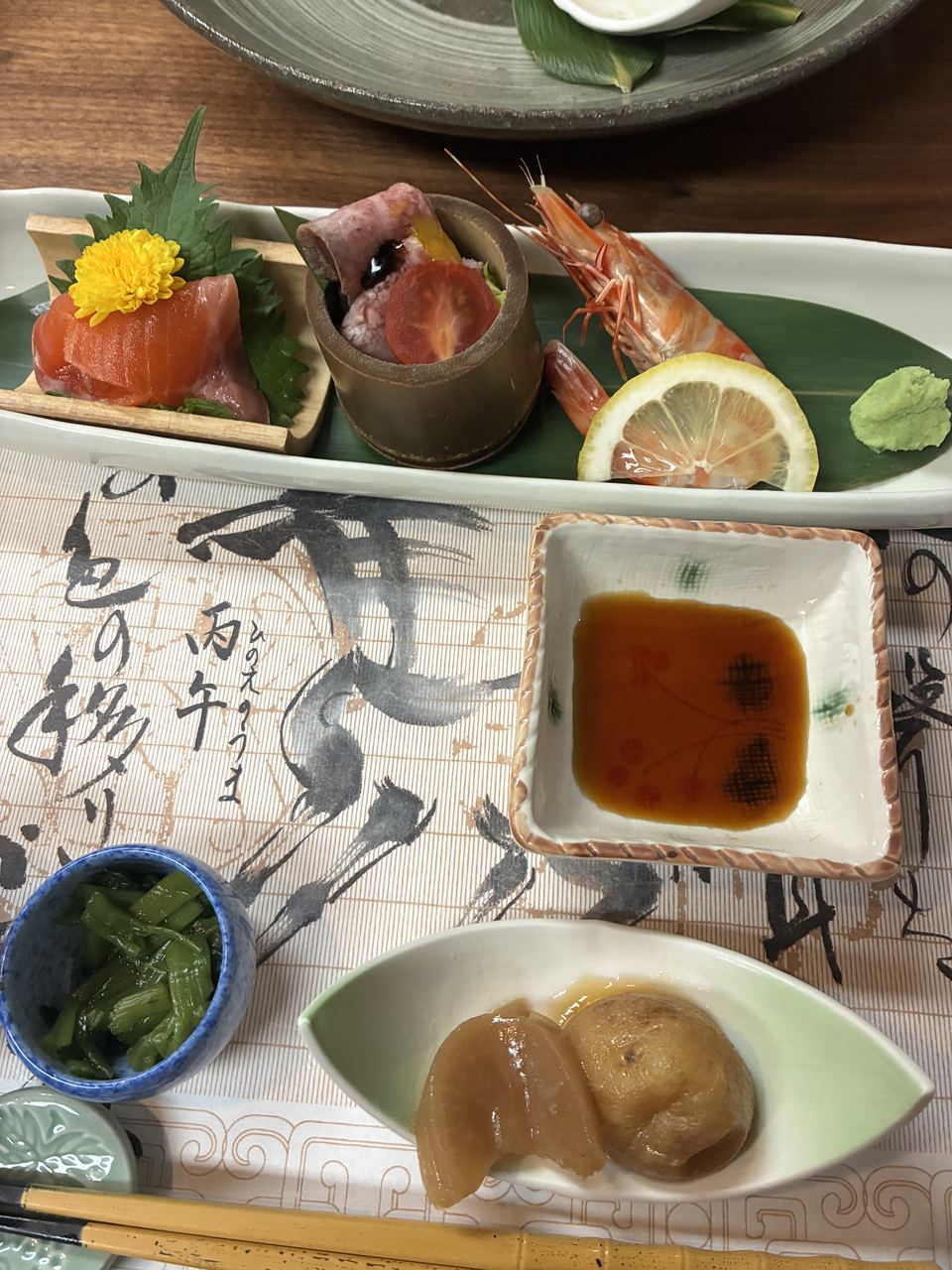 Roasted Hida wagyu beef plated with shrimp, salmon and seasonal mountain vegetables on Night 1 at Yarimikan